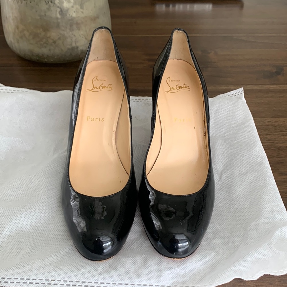 Louboutin black heeled pumps